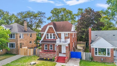 View of front of house featuring a gate and a chimney