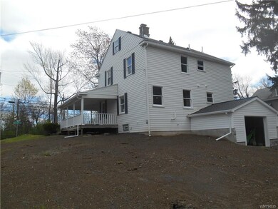 Large front porch wraps around to the side of the 