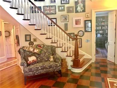 The welcoming two story entry, with hand-painted p