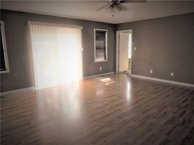 ANOTHER VIEW OF FAMILY ROOM, SHOWING PATIO DOORS L
