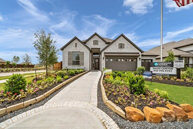 Chesmar Homes model home showcasing the 3-car garage! Note, photo is not of the actual home.