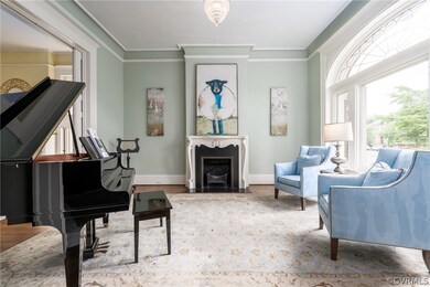 Parlor with stunning Palladian window.