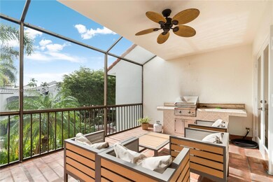 Terrace off the living room with a view of the pool