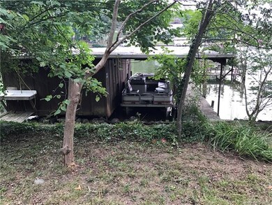 Enclosed boathouse, and open sided boatslip