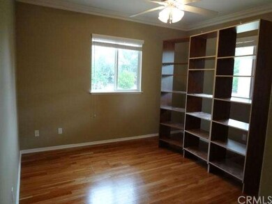 Bonus room/den with bookshelves.
