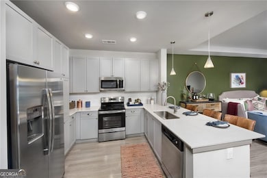 Kitchen with kitchen peninsula, light wood-type fl