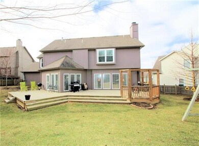 Expanded deck and fenced backyard