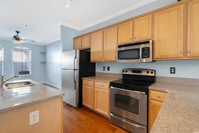 Kitchen with stainless steel appliances, sink, orn