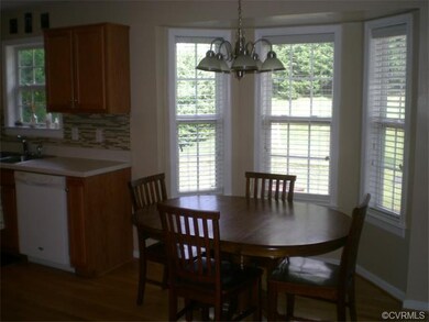 The breakfast area features hardwood flooring and 