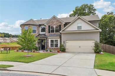 Craftsman house featuring brick siding, driveway, 