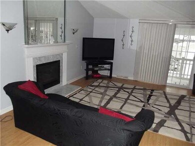 Living Room Sliding glass doors lead to covered pa