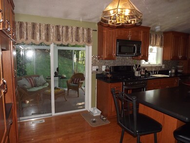 Access to 3 Season Porch leading to spacious deck.