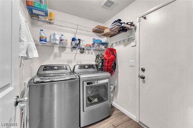 Washroom with washing machine and clothes dryer an