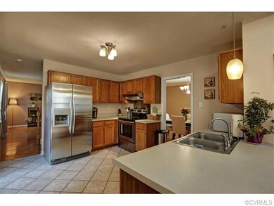 Open kitchen with stainless steel appliances, cust