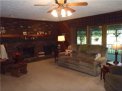 Family Room. Family room with brick masonary gas fireplace, 2 sided to the master bedroom.