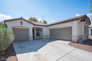 Mediterranean / spanish-style home with a garage,