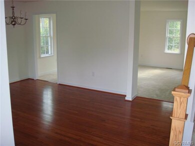 Open and bright multi-purpose room has hardwood fl