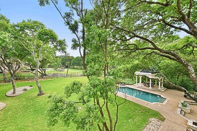 Outdoor pool with a yard, a gazebo, a patio, and 