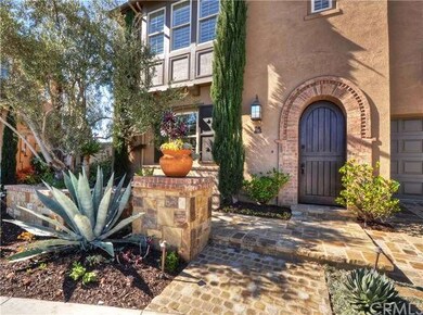 Dutch door entry with stone walkway and mature cus