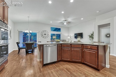 Recessed lighting in open kitchen, dining room, & living room