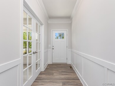 Doorway to outside featuring wood-type flooring, c