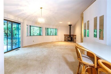 The main living area offers vaulted ceilings, an o
