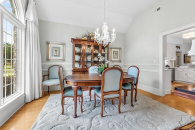 Dining area with light wood-type flooring, lofted 