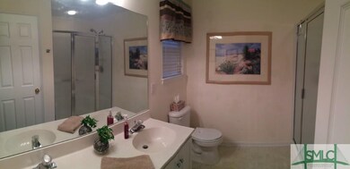 The Master Bathroom has double vanities, an extra 