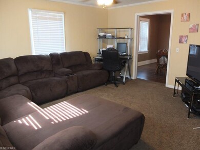 Family room with crown molding.