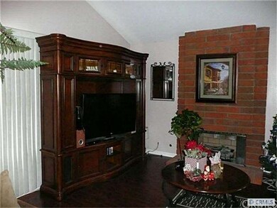 Living room with brick fireplace