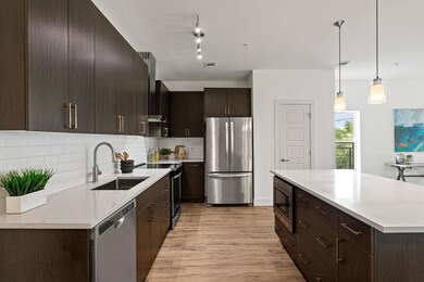 Kitchen with a sink, light wood finished floors, 