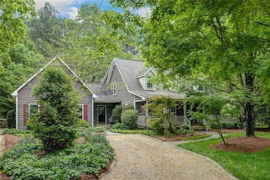 THIS VIEW IS AT THE SPLIT DRIVEWAY ... THE DOOR YOU SEE IS GOING INTO THE LEFT WING OF THE HOME.