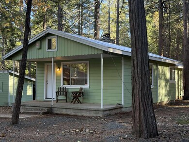 front right, fire wood shed shown in background