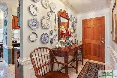 Foyer.  Ceramic tile flooring, picture molding bel