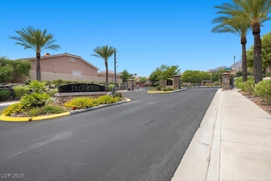 View of asphalt street featuring sidewalks, curbs,