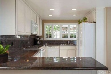 Gleaming granite counters, bright cheery light, co