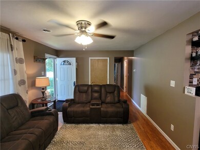 Another view of living room shows the coat closet.