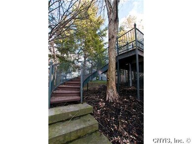 Exterior Back. Magnificent staircase leads from up