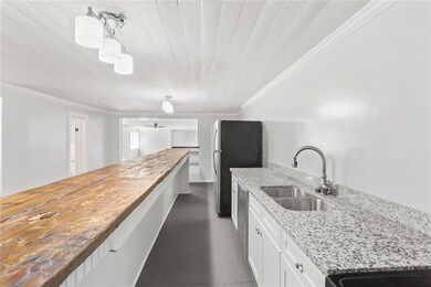 Another look at the kitchen towards the living roo
