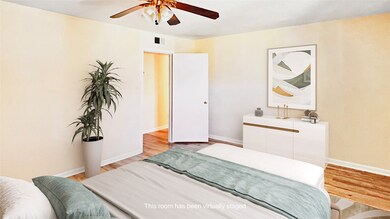 Serene bedroom oasis featuring ample natural light