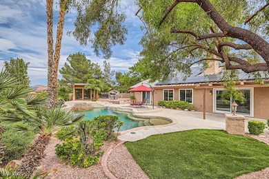 Swimming pool featuring an in-ground hot tub, a pa
