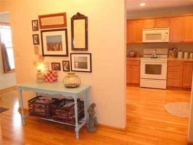 Foyer foyer with gleaming hardwood floors