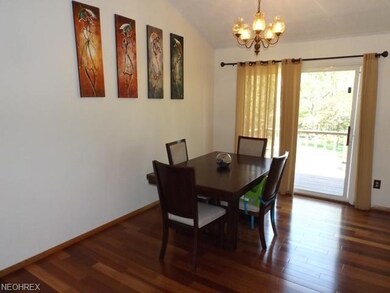 Dining room with hardwood flooring