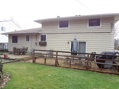 The back side of the home has a two tier deck that