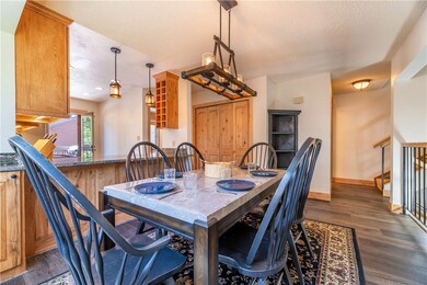 Bright kitchen/dining area with updated light fixt