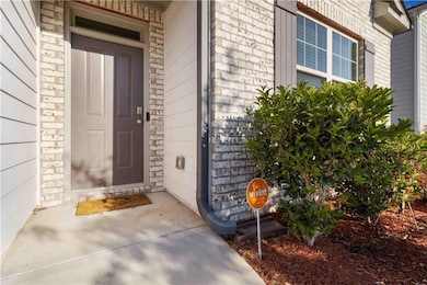 Entrance to property with brick siding
