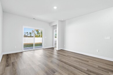 Empty room with light hardwood / wood-style floori