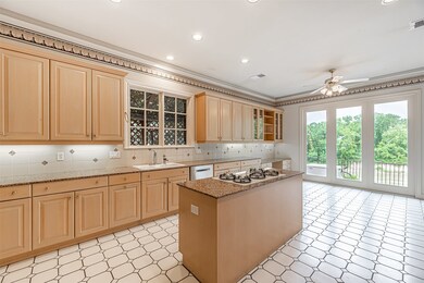 Spacious kitchen features patterned tile flooring