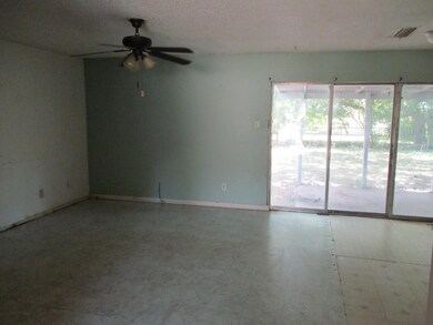 Living room featuring a textured ceiling and ceili