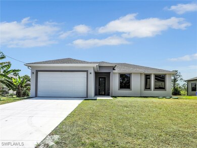 View of front facade featuring a front yard, an at
